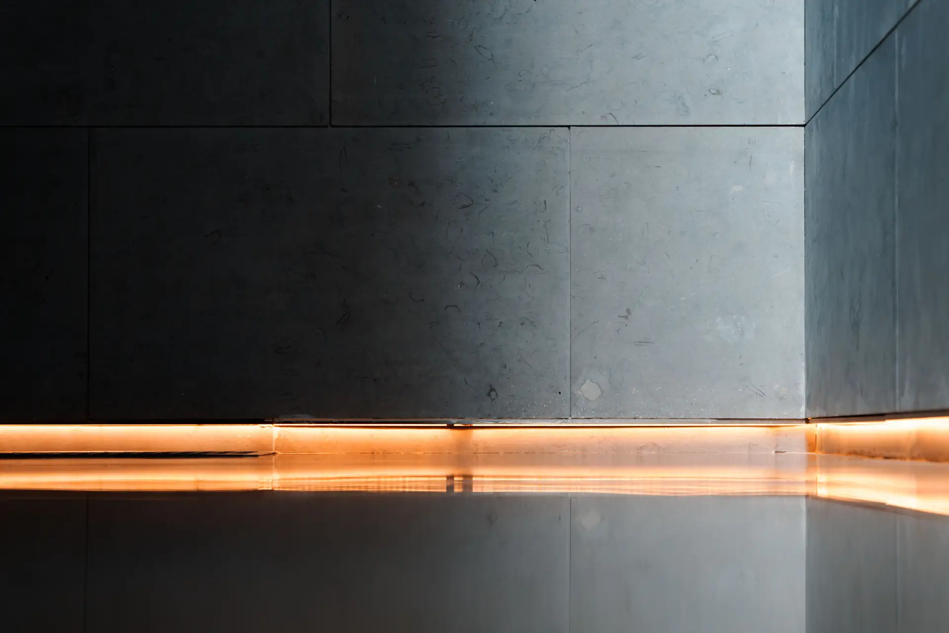 Considered architectural interior with refined wood panels and ambient lighting by Aureqorianessava