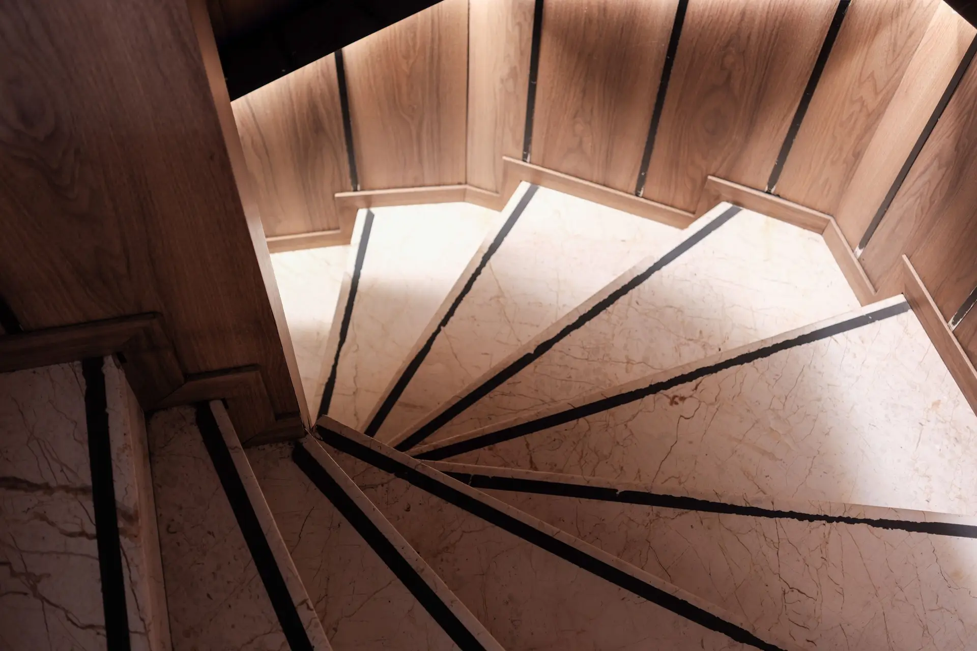 Sculptural marble and timber staircase joinery in Chelsea private home