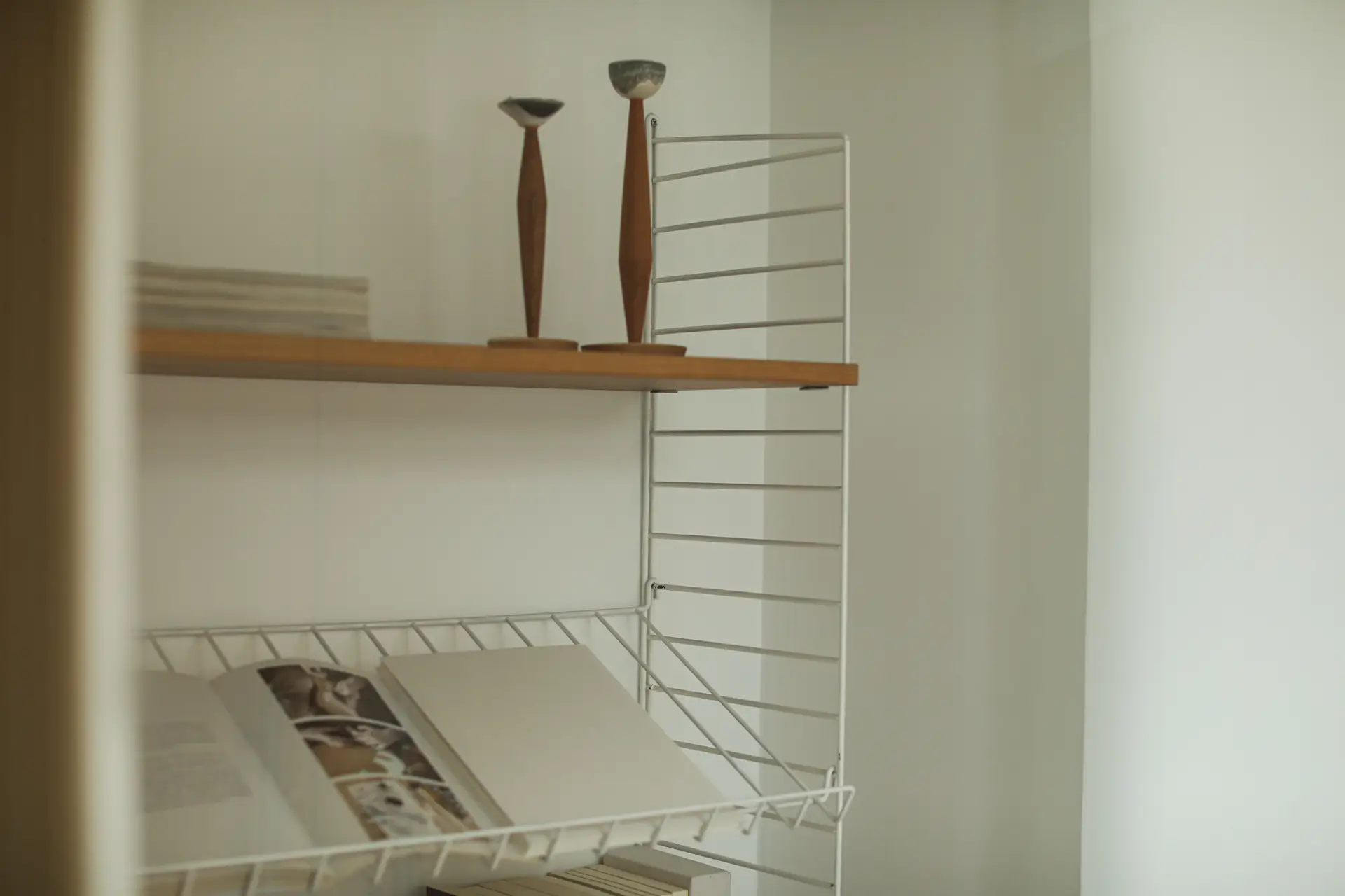 Tactile accessories, ceramics and curated furnishings in a styled living space