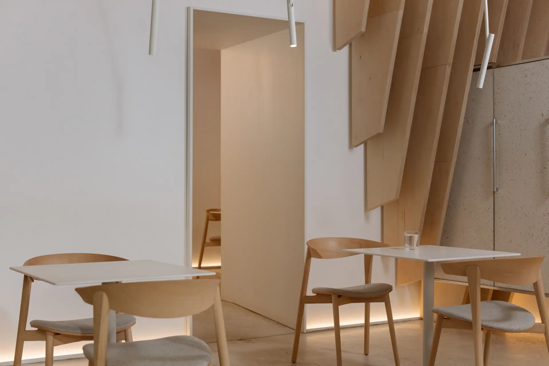 Warm timber, curated lighting and architectural detailing in private London residence