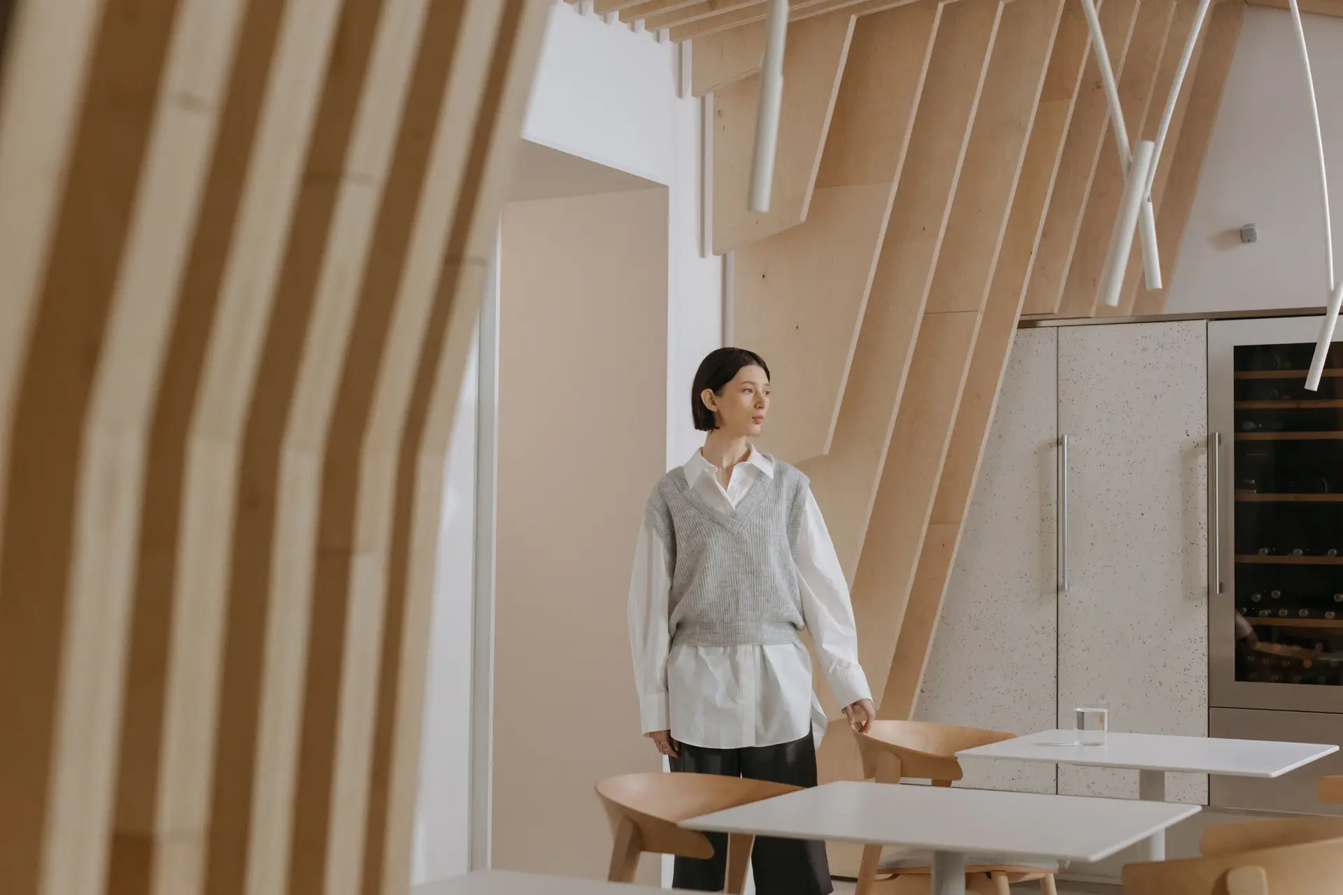 Atmospheric bespoke architectural interior with warm cedar fins